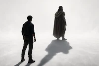 a man and a woman standing next to each other in the fog