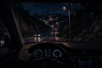 a person driving a car at night