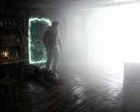 a man is standing in a dark room with a flashlight